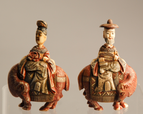 Appraisal: Two Carved Polychromed Ivory Figural Snuff Bottles a gentleman and