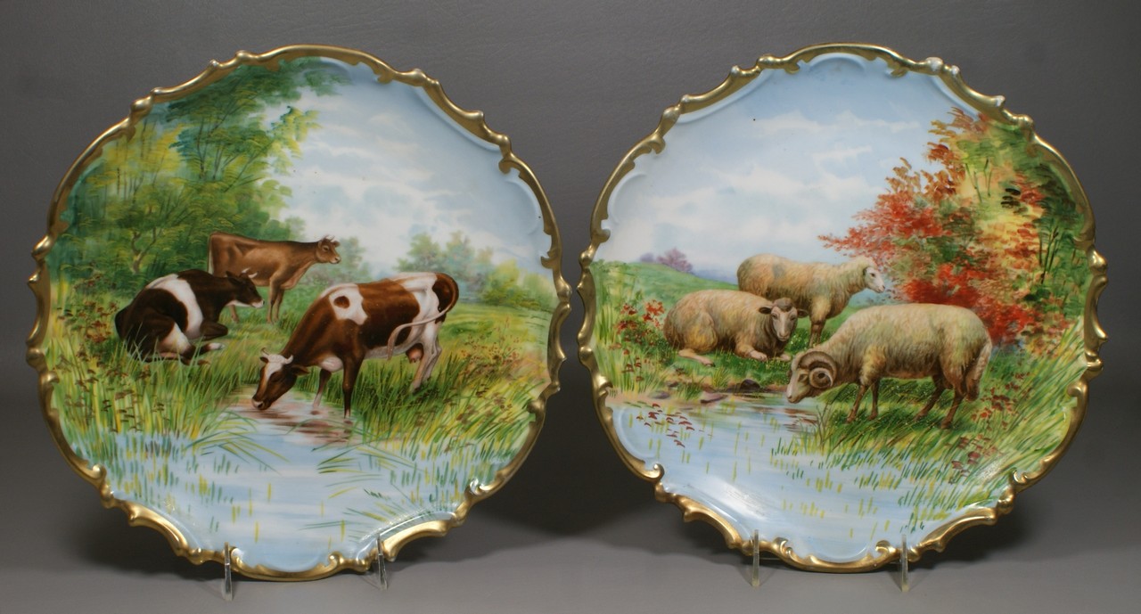 Appraisal: Two Austrian hand painted wall chargers decorated with cows and