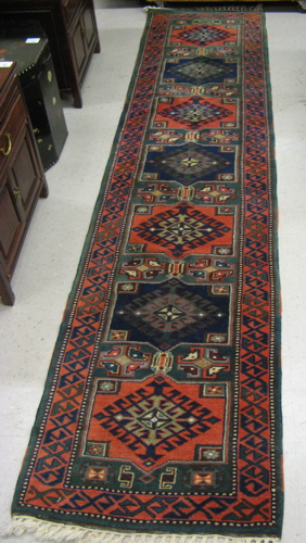 Appraisal: TURKISH RUNNER hand knotted in an overall geometric design '