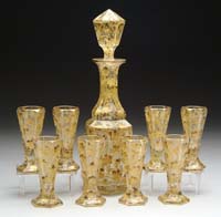 Appraisal: MOSER DECANTER SET Cut glass decanter has heavily enameled gold