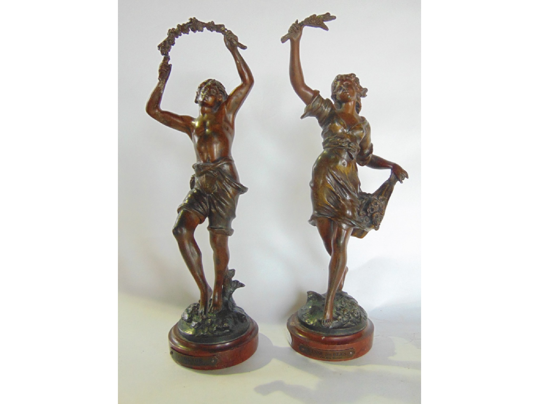 Appraisal: A pair of French bronze figures with patinated finish one