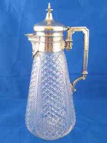 Appraisal: A Victorian silver mounted cut glass claret jug with diaper