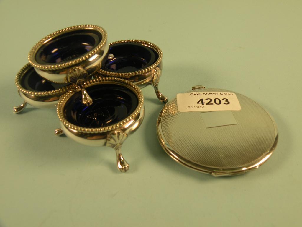 Appraisal: A silver engine turned powder compact and a set of