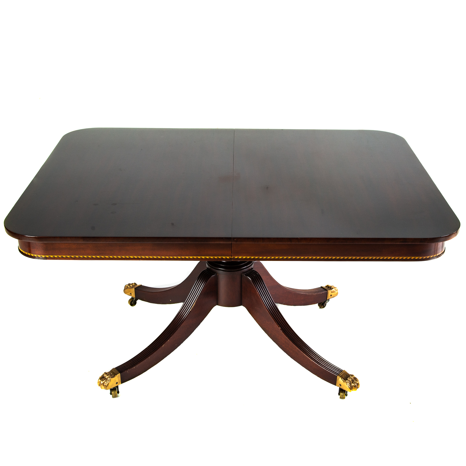 Appraisal: POTTHAST BROTHERS MAHOGANY PEDESTAL DINING TABLE With carved reeded legs