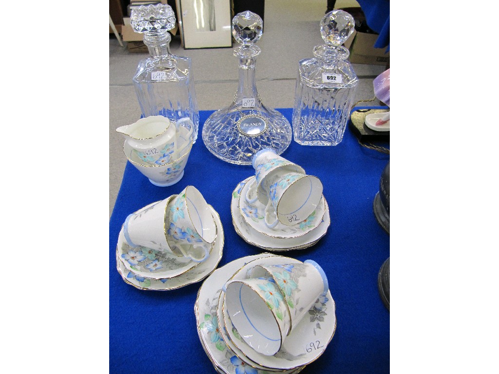 Appraisal: Three crystal decanters and a Royal Stafford bone china teaset