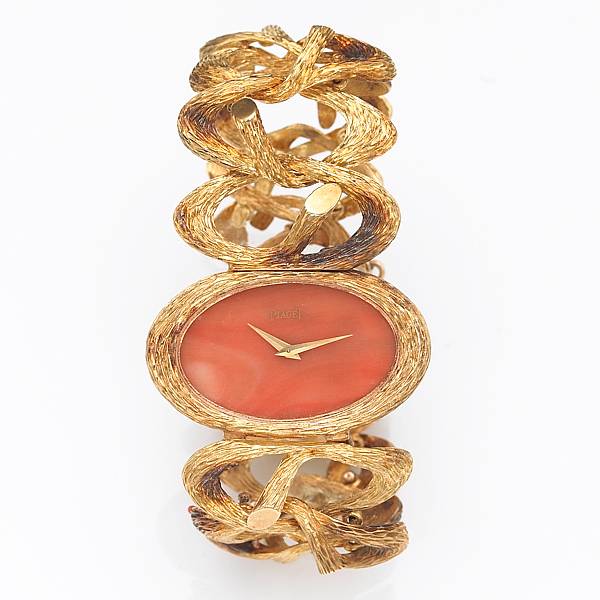 Appraisal: A lady's k gold bracelet watch with coral dial Piaget