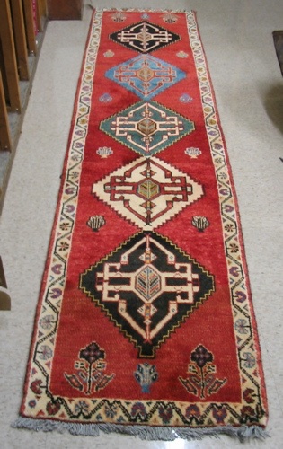 Appraisal: PERSIAN SHIRAZ RUNNER having five diamond-shaped medallions in a variety