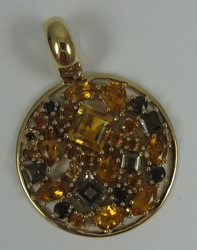 Appraisal: CITRINE SMOKY QUARTZ AND K GOLD PENDANT set with facet-cut