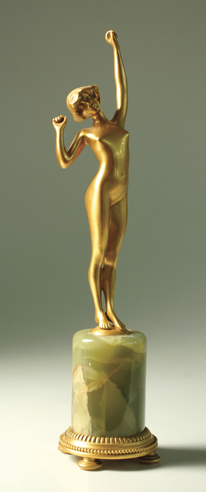 Appraisal: GILT BRONZE FIGURAL SCULPTURE depicting standing nude female figure with