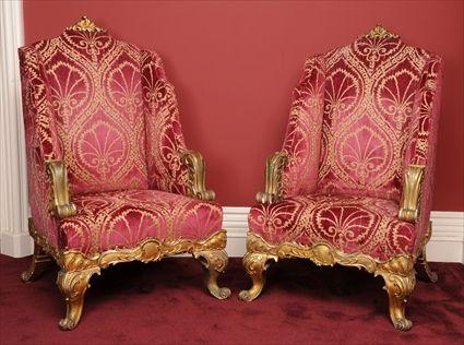 Appraisal: PAIR OF ROCOCO-STYLE CARVED GILTWOOD BERGERES Each with shaped crest