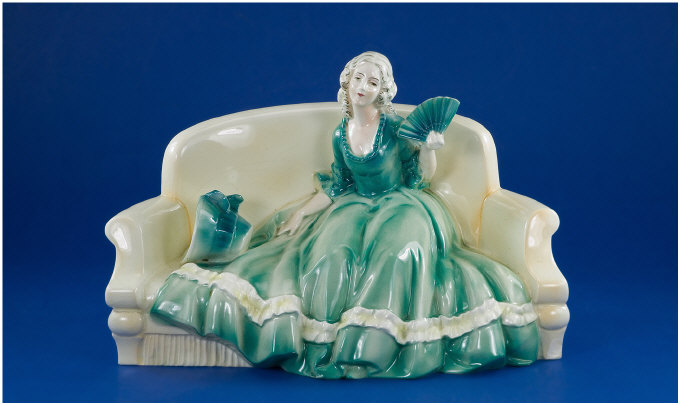 Appraisal: Katzhutte Figure of a lady on a sofa Measures x