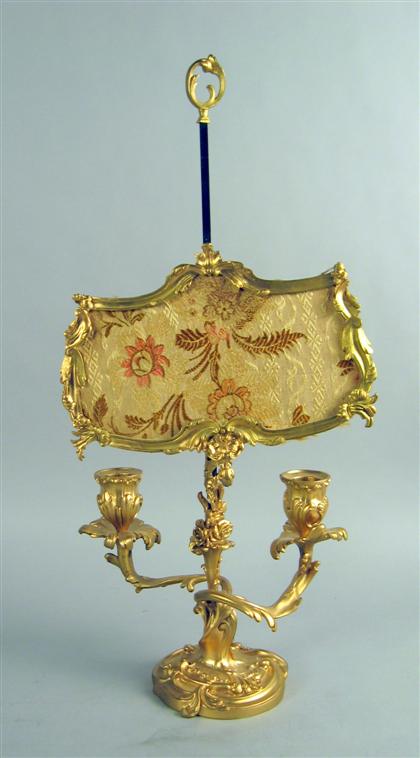 Appraisal: Louis XV style gilt and patinated bronze candelabrum The central