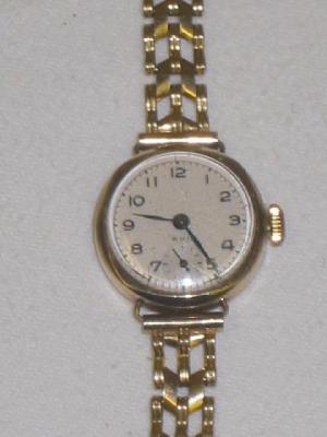 Appraisal: A CT GOLD LADY'S WATCH the silvered circular dial inscribed