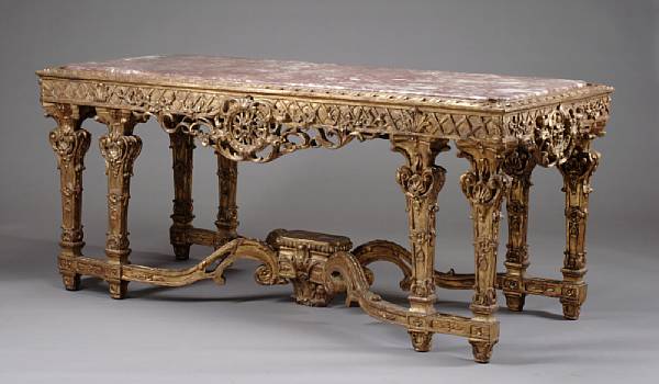 Appraisal: A Louis XVI style carved giltwood center table Surmounted by