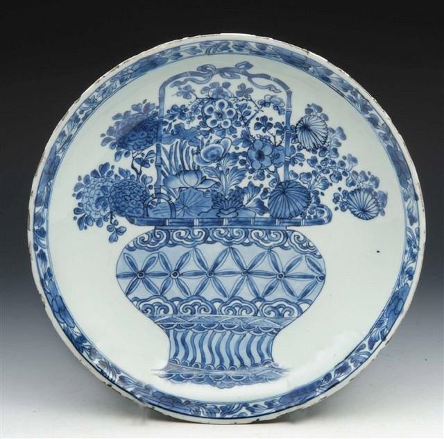 Appraisal: A KANGXI LARGE BLUE AND WHITE FOOTED DISH of shallow