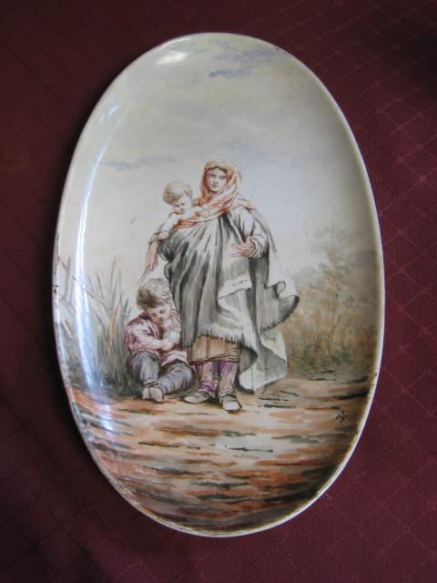 Appraisal: A French oval Dish painted mother with two children signed