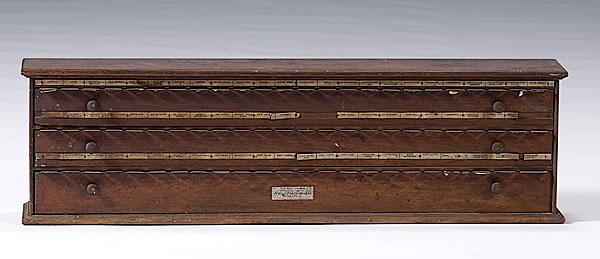 Appraisal: MCCOURT LABEL CABINET mahogany Storage for pharmaceutical bottle labels includes