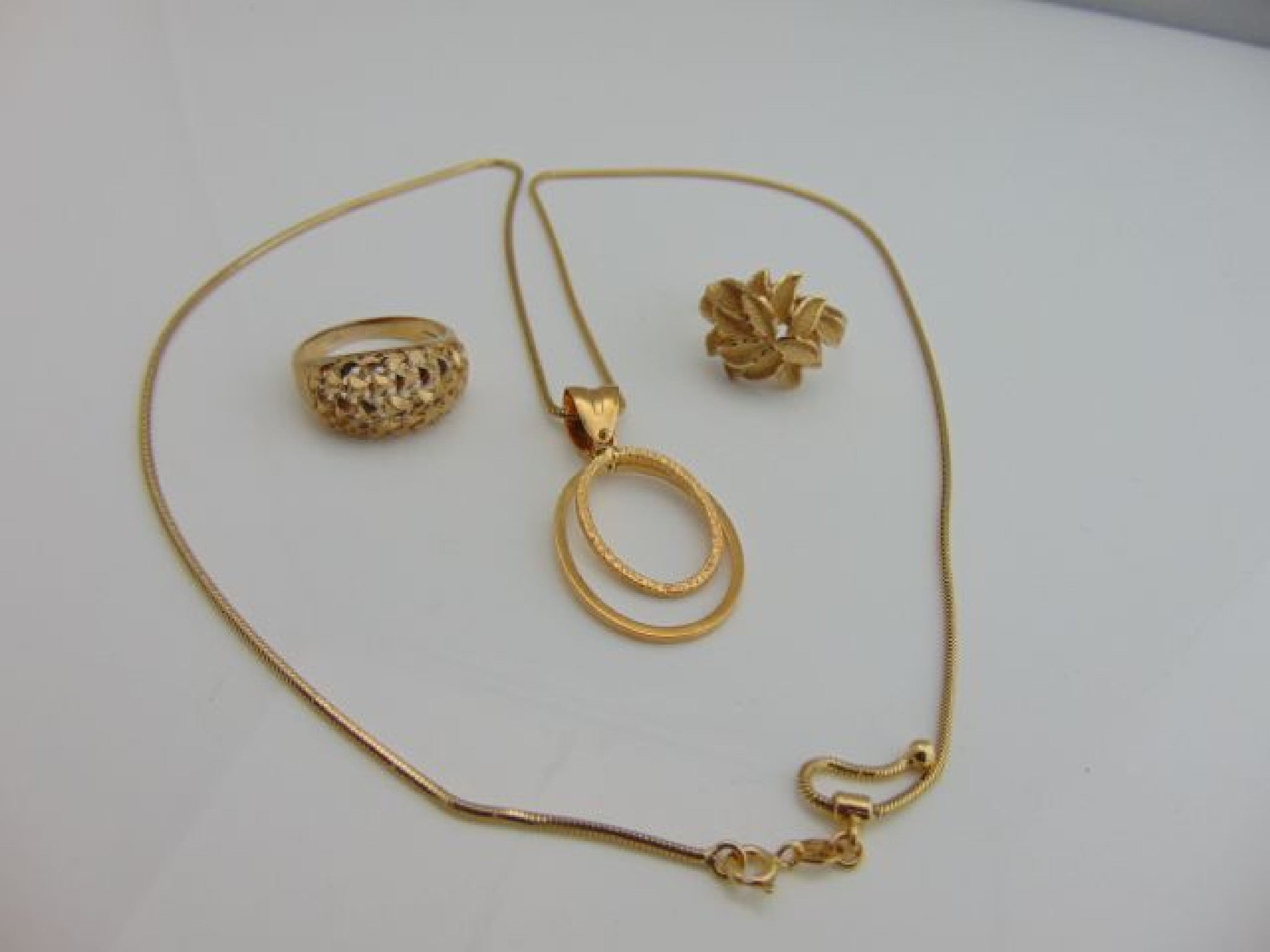 Appraisal: An Italian ct gold pendant composed of two oval motifs