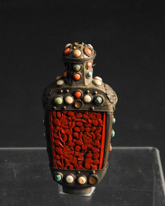 Appraisal: A th C Chinese Cinnabar Snuff Bottle mounted in a