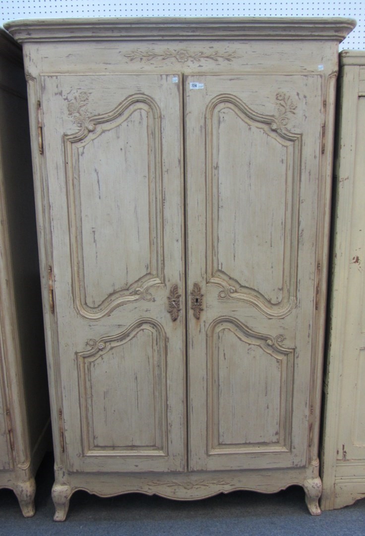 Appraisal: A Louis XV style distressed cream painted two door armoire