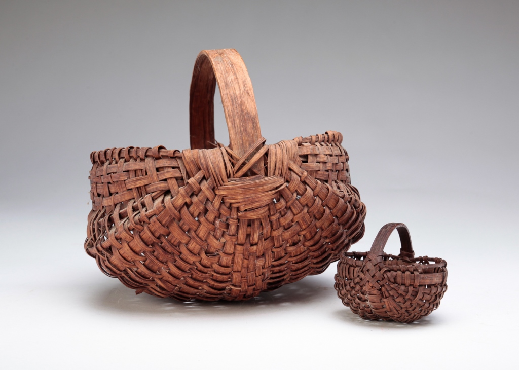 Appraisal: TWO AMERICAN BUTTOCKS BASKETS Early th century Woven splint with