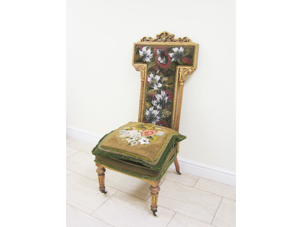 Appraisal: A Victorian Prayer Chair with floral beadwork upholstery on turned