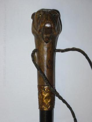 Appraisal: A VICTORIAN WALKING STICK the hardwood grip carved as a