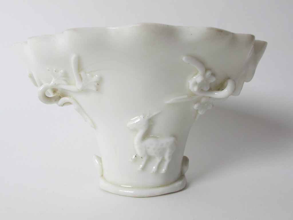 Appraisal: A Chinese blanc de chine libation cup moulded with a