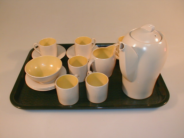 Appraisal: A Susie Cooper Crownworks coffee service kestrel shape coloured in