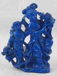 Appraisal: A Chinese lapis lazuli carving of a lady and a