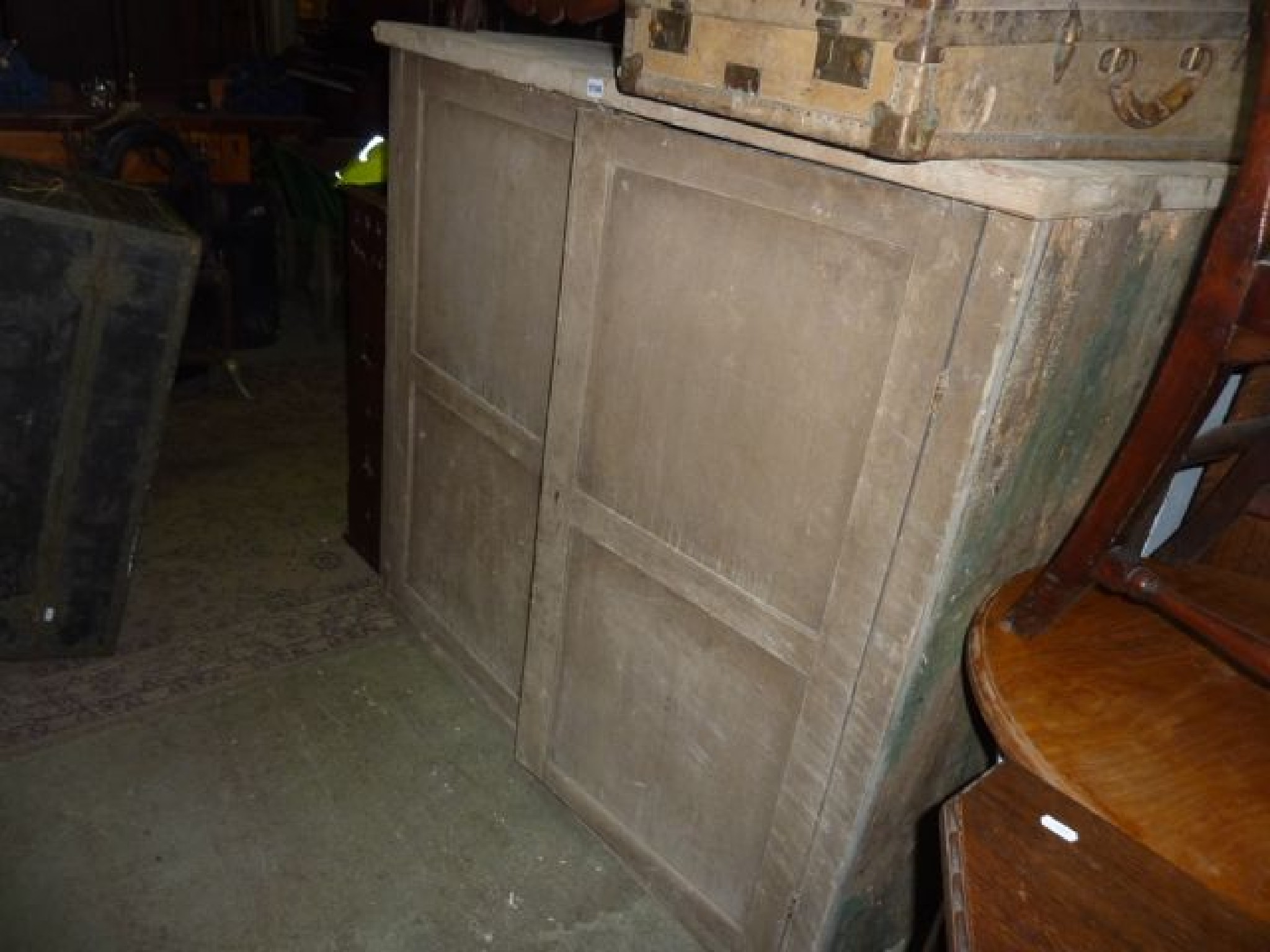 Appraisal: A substantial stripped pine side cupboard enclosed by two panelled