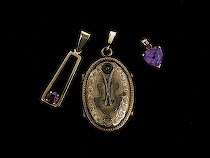 Appraisal: Lot of Three Different Gemstone Pendants Golden locket pendant features