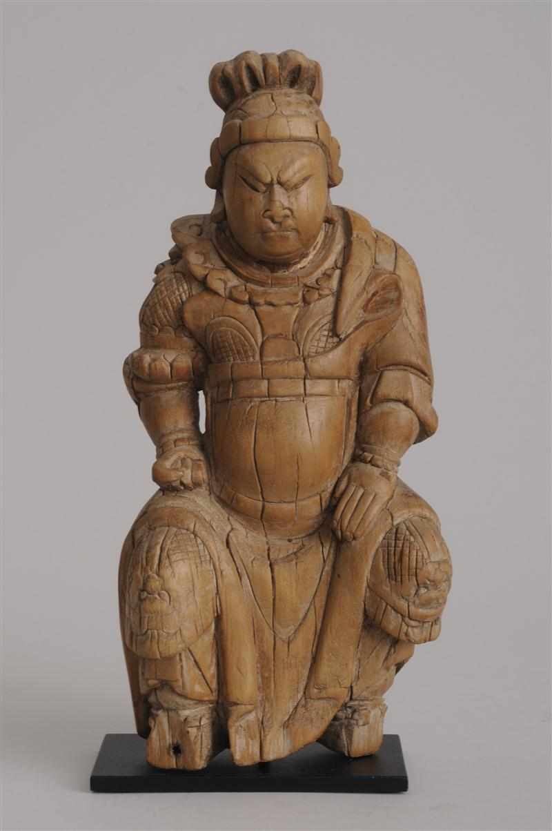 Appraisal: CHINESE CARVED WOOD FIGURE OF A SEATED LORD The frowning