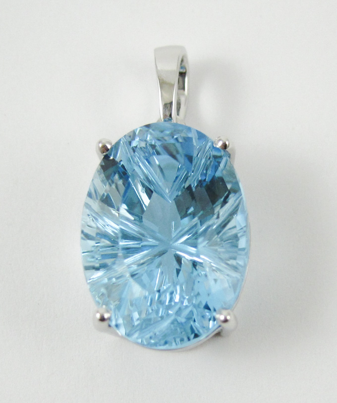 Appraisal: BLUE TOPAZ AND FOURTEEN KARAT WHITE GOLD PENDANT set with