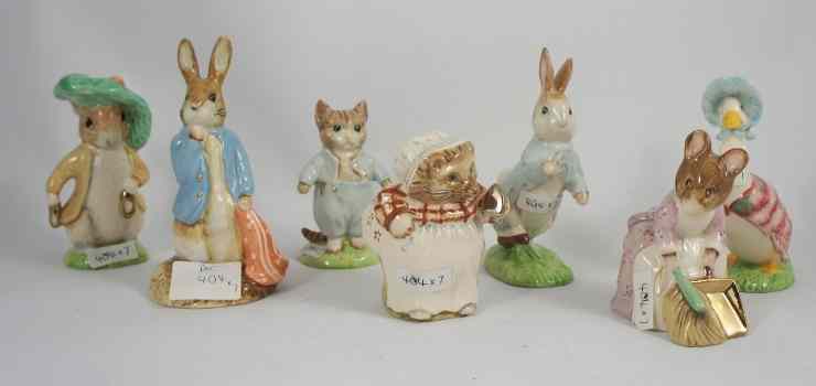 Appraisal: Beswick Beatrix Potter Gold Accent Figures Mrs Tiggywinkle Hunca Munca