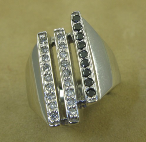 Appraisal: BLACK DIAMOND AND COLORLESS DIAMOND RING k white gold and