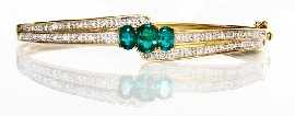 Appraisal: A ct gold green stone and diamond oval hinged bangle