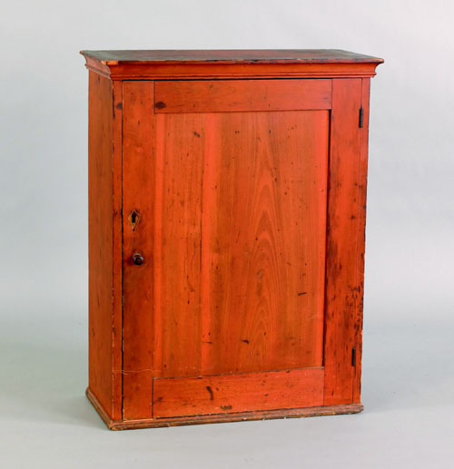 Appraisal: Pennsylvania stained pine hanging cupboard early mid th c retaining