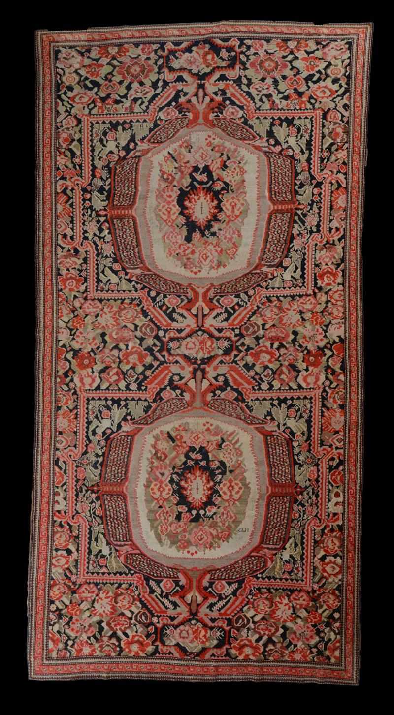 Appraisal: BESSARABIAN CARPET Woven with two central medallions within a floral