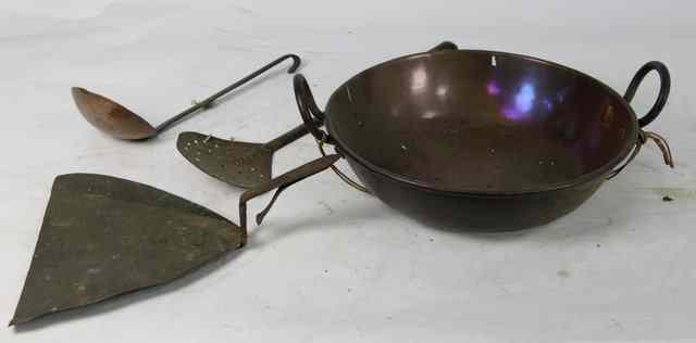 Appraisal: A two-handled pan and three chestnut roasters with iron handles