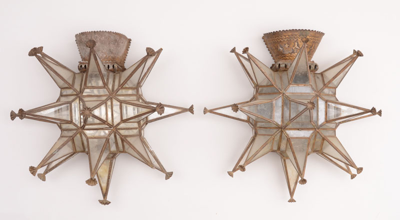 Appraisal: PAIR OF DECORATIVE TIN-MOUNTED GLASS-MOUNTED STELLATE WALL LIGHTS Each multiple-rayed