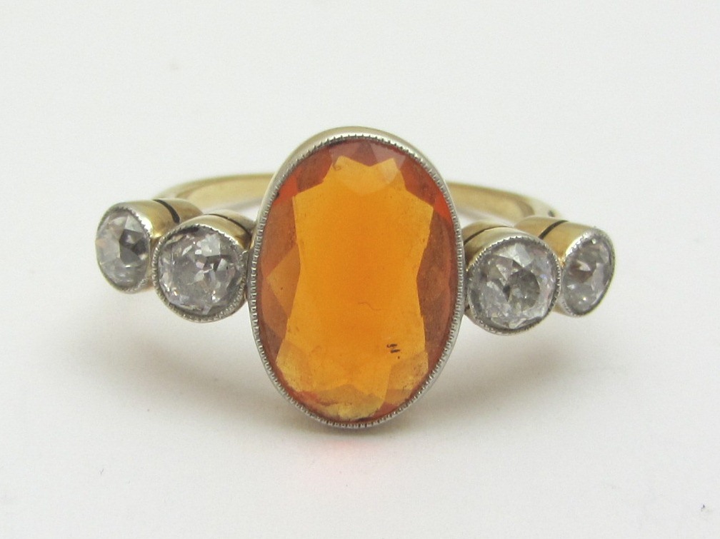 Appraisal: A gold fire opal and diamond set five stone ring