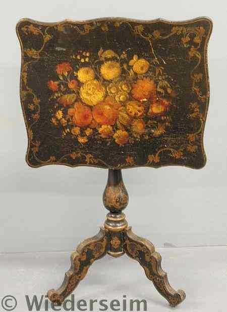 Appraisal: Victorian japanned tilt-top tea table the top with colorful floral