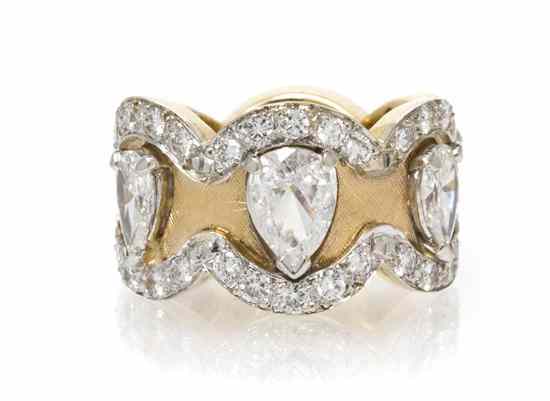 Appraisal: A Karat Gold and Diamond Eternity Band in a scalloped