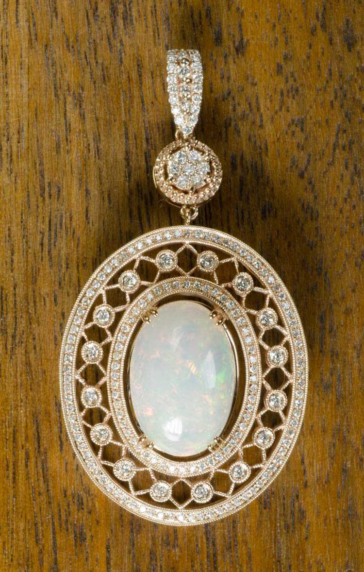 Appraisal: OPAL AND FOURTEEN KARAT ROSE GOLD PENDANT with round-cut diamonds