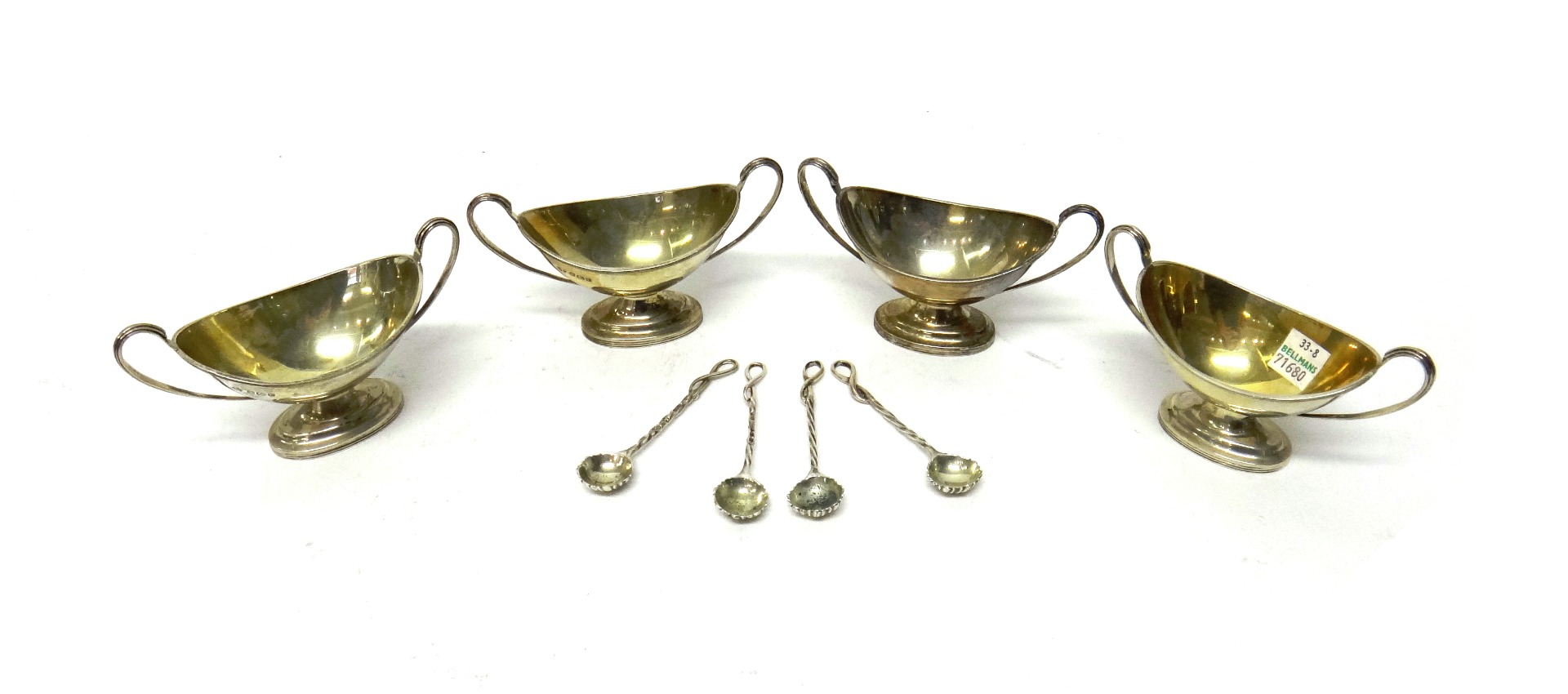 Appraisal: Silver comprising a set of four oval twin handled salts