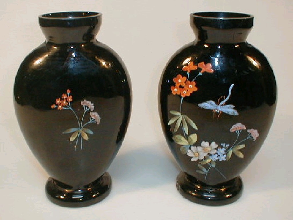 Appraisal: A pair of Victorian black glass ovoid vases decorated with