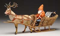 Appraisal: REINDEER CANDY CONTAINER WITH SANTA IN MOSS SLEIGH A fine