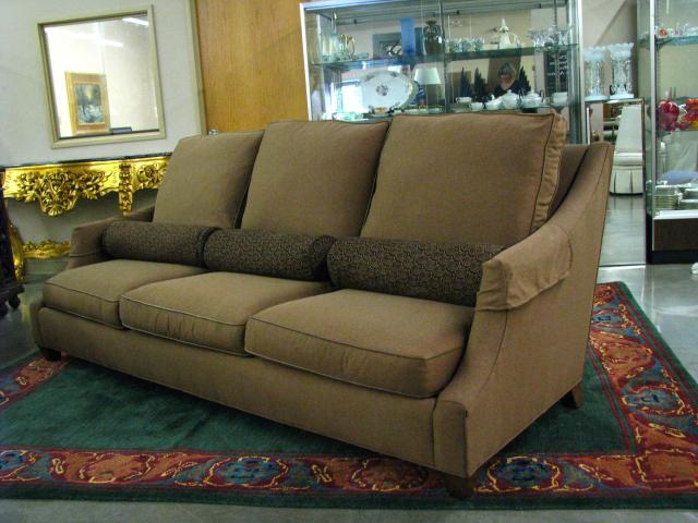 Appraisal: Isenhour contemporary style three cushion sofa with brown upholstery and