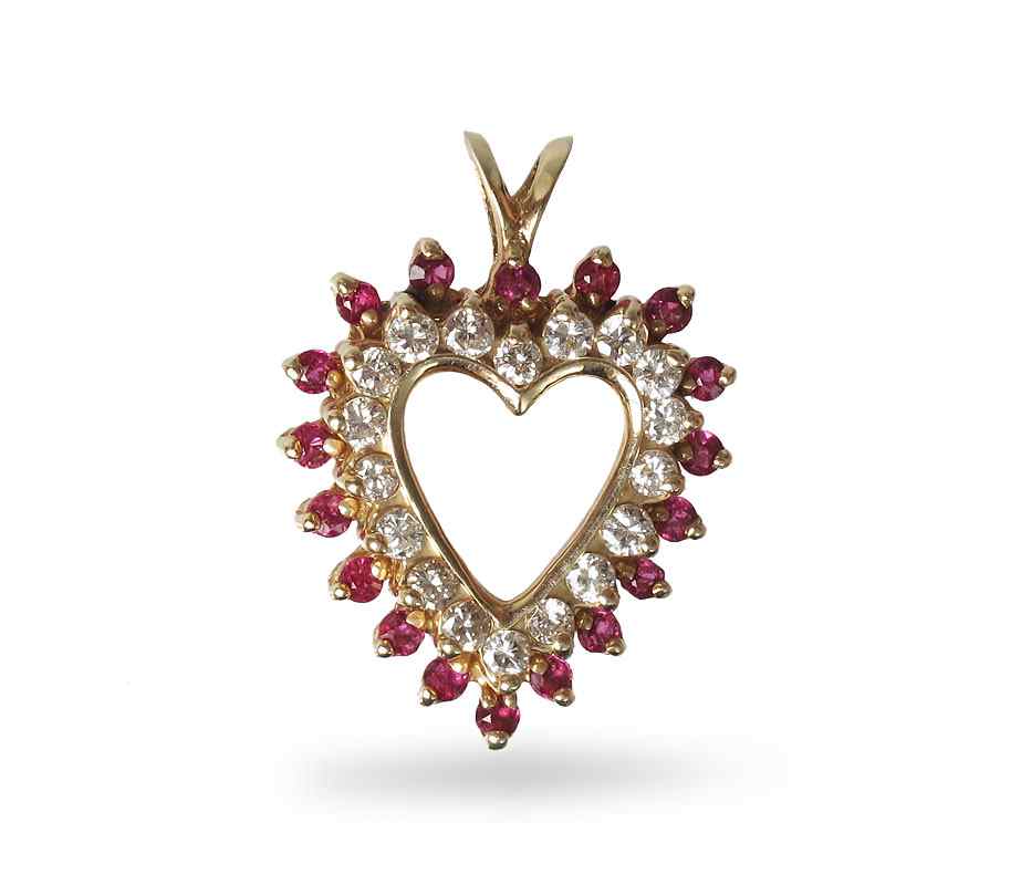 Appraisal: RUBY DIAMOND HEART PENDANT K yellow gold pendant contains round